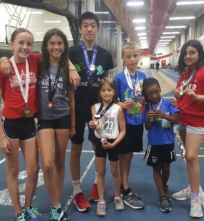 A group of Variety Village members posing with their medals.
