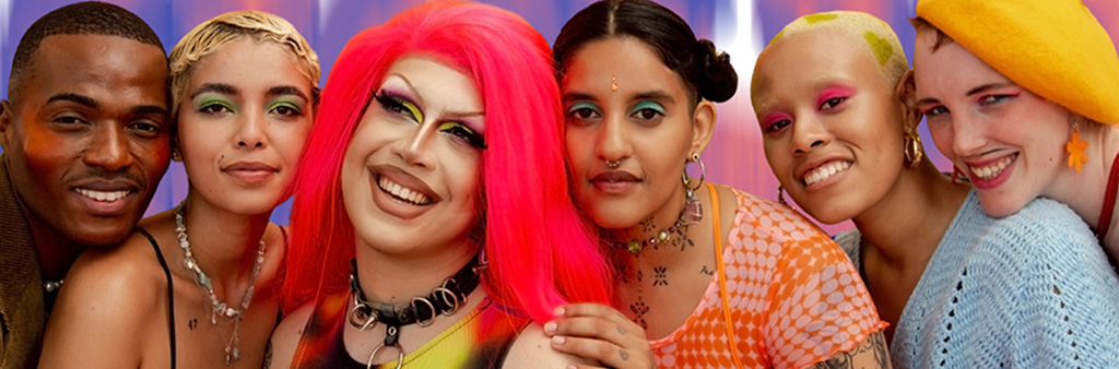 A close up of a group of colourfully dressed people posing for a photo