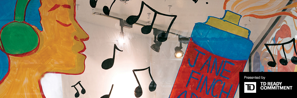 Close up of glass window painted with the profile of a person wearing headphones, music notes, and spray paint can labelled Jane and Finch