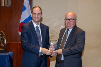 Toronto City Manager poses with John Elvidge receiving an award.