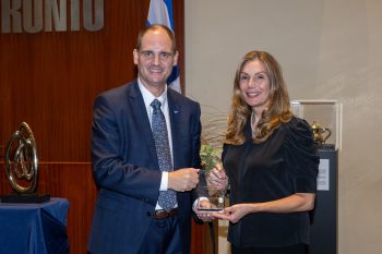Toronto City Manager poses with Diane Silver receiving an award.