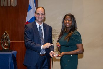 Toronto City Manager poses with Tommica Givans receiving an award.