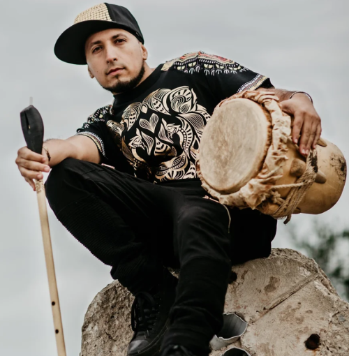 Male Artist holding drum