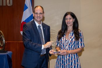 Toronto City Manager poses with Laura Metcalfe receiving an award.