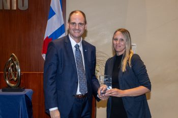Toronto City Manager poses with Anya Murphy receiving an award.