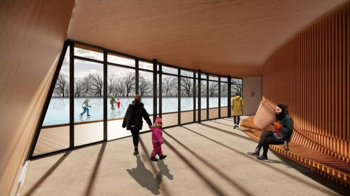 Rendering of the seating area in the recreation building, with floor-to-ceiling windows on one side that overlook a terrace and pond. A curved bench made of narrow wooden strips connects to the adjacent wall, which shares the same design. The interior features concrete floors and wood finishes on the walls and ceilings. A spacious passageway in the middle leads to washrooms located around the corner.