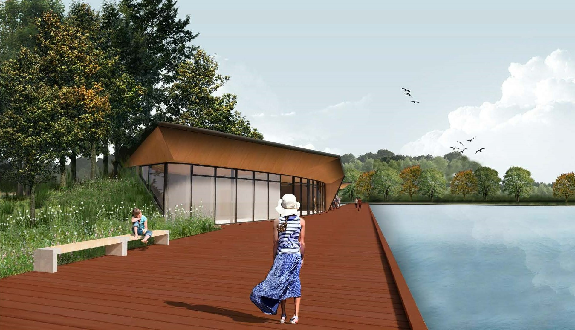 Rendering of the terraced walkway leading to the entrance of the recreation building on the left, with the pond on the right. A concrete bench with wood accents sits beside the walkway, surrounded by green plants and trees in the distance. Ahead, the left side of the building is partially covered by a vegetated earth berm before transitioning into large glass windows. A wood trim atop the windows and beneath the flat roof extends to meet the terrace on one end.