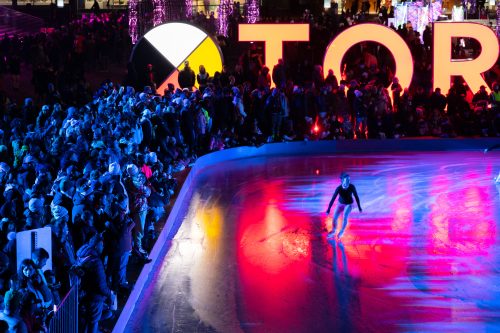 Solo skater performing in Nathan Philips Square.