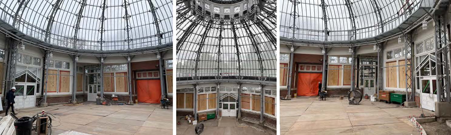 A photograph with three images side by side of the Palm House building interior from different angles, with scaffolding removed. The circular space features a large domed roof, boarded windows and an unfinished floor. On the left, a ground-level view of the area to the left of the main entrance, with a worker visible by the doors and scattered equipment. In the middle, a close-up of the domed roof structure made of glass and metal framing. On the right, a ground-level view of the area to the right of the main entrance.