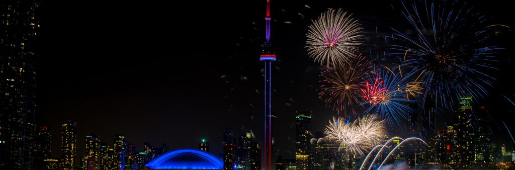 Fireworks over waterfront with Toronto skyline in background