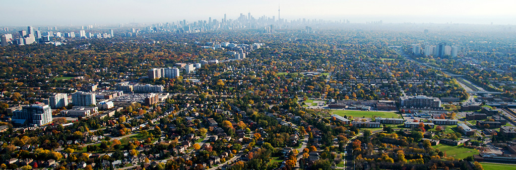 An aerial view of Toronto looking south with the downtown skyline in the distance.