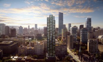 A tall building in a city with many windows.