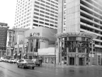 Toys “R” Us building with other retail shops next to it and apartment units above it.