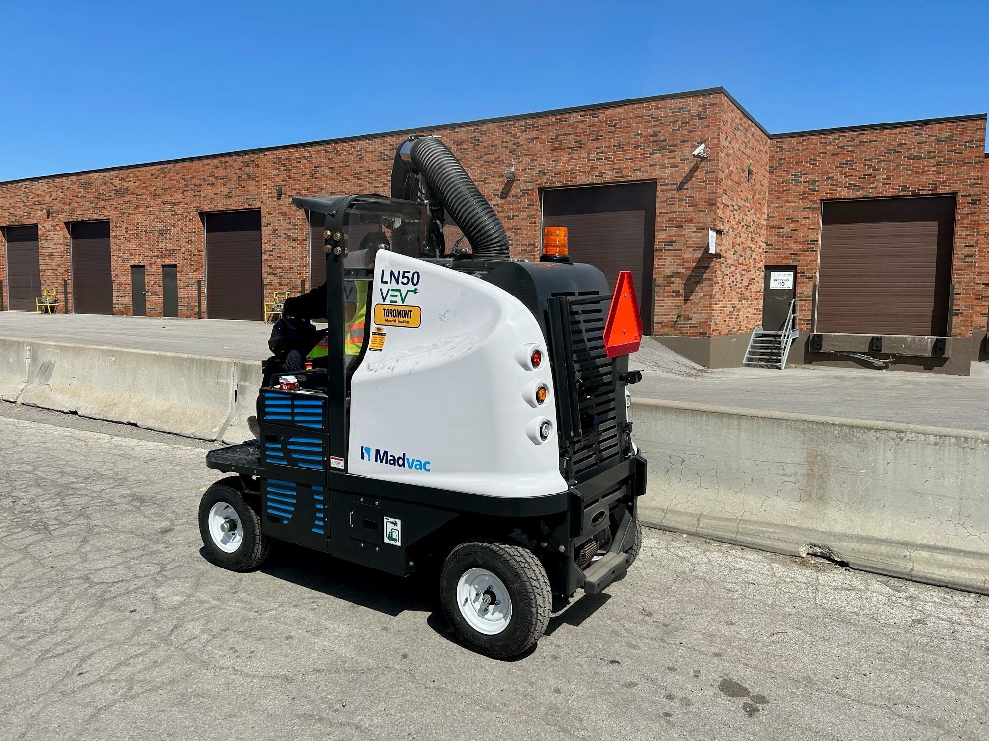 Madvac in a parking lot