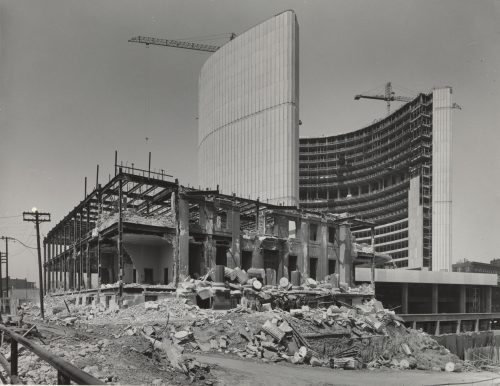 Monochrome photograph of demolition site.