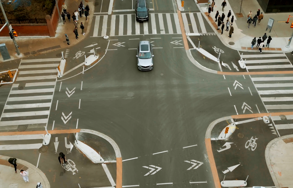 An overhead view of a protected intersection at Bloor Street West and St. George Street. 