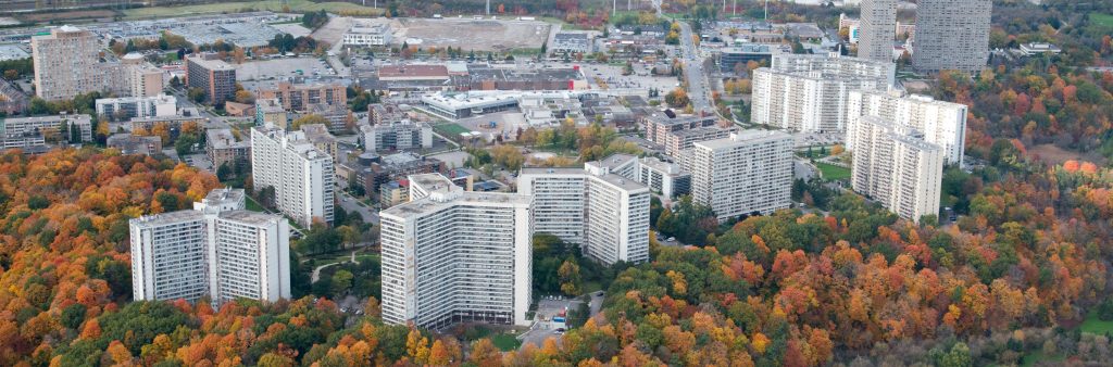 Banner image for the Apartment Infill Study webpage. Image shows an aerial view of apartment tower sites with surface parking, surrounded by open space and tree canopy.