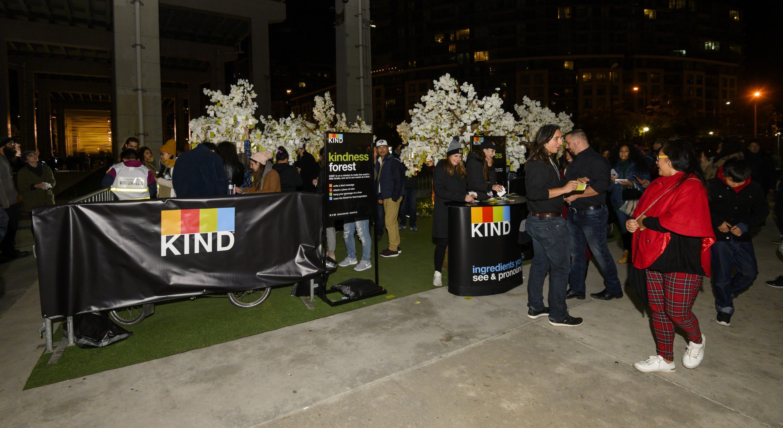 Attendees interact with KIND Snacks