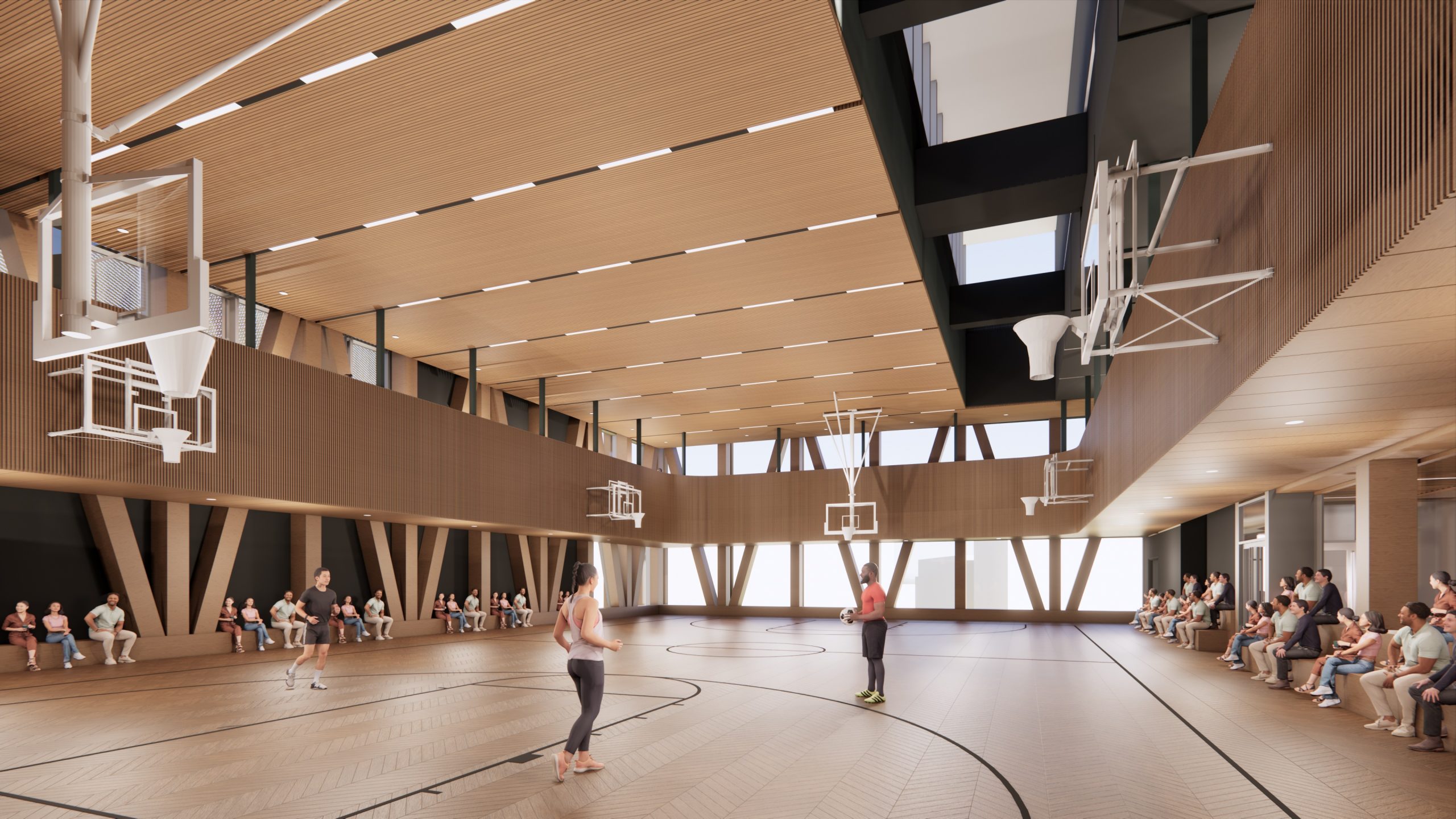 Interior view of the new Lawrence Heights Community Recreation Centre showing the new double gymnasium with built-in bench seating and a mezzanine walking track.