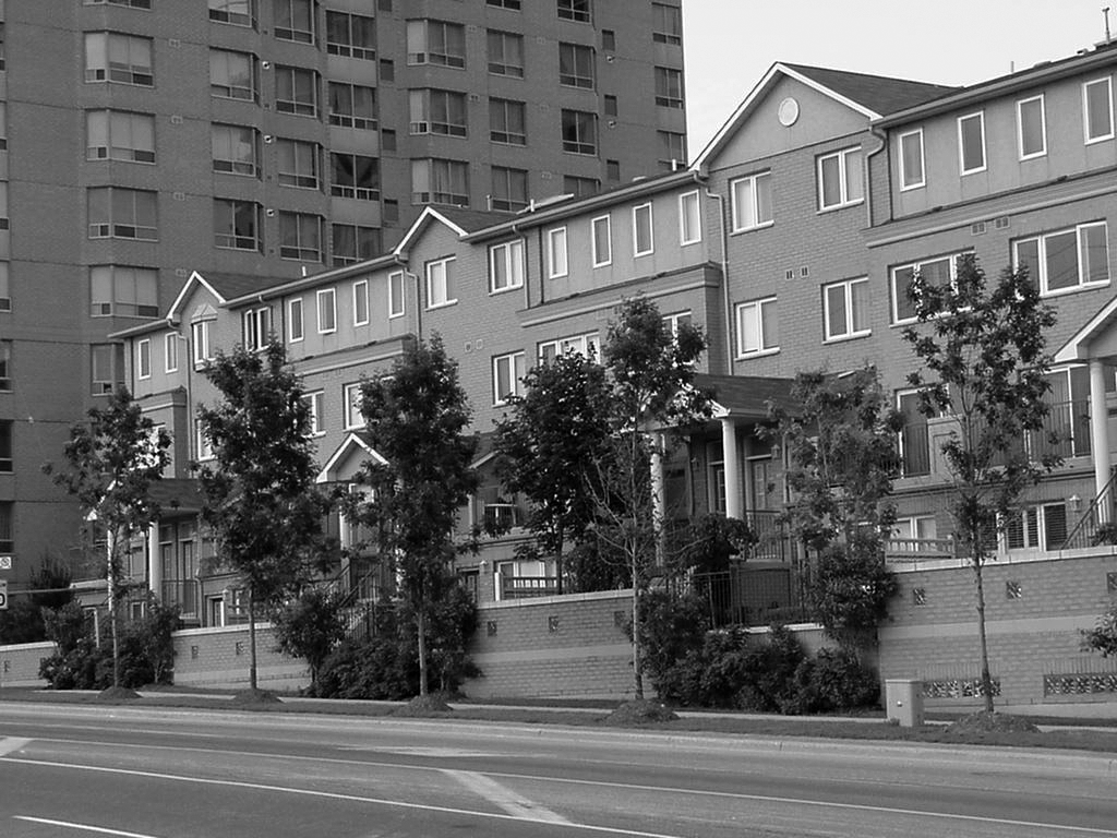 A row of houses on a street.