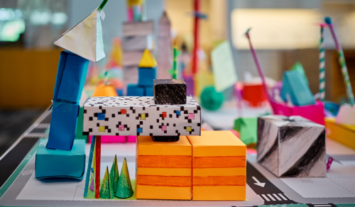 Folded paper buildings set up as a streetscape 