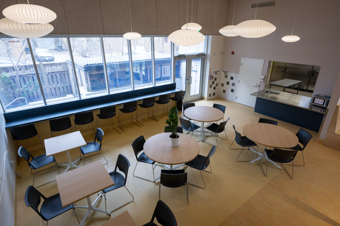 A dining area with circular tables and chairs at 25 Cantebury Place