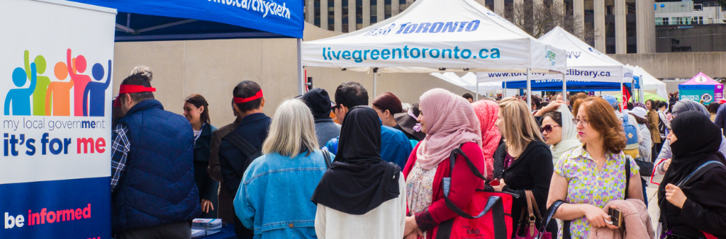 Crowded booths at outdoor fair