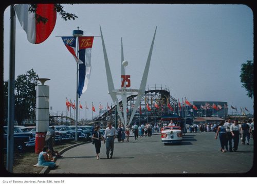 People at the CNE, with roller coater in background