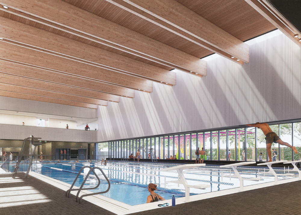 Rendering of the aquatic hall in the community centre. In the foreground is a six-lane lap pool with starting platforms on one side. A grey tiled floor surrounds the pool, with lifeguard’s seats, rails and ramps visible. In the background are changerooms and a second-floor balcony. Large windows on the right provide views of the pedestrian promenade along the building exterior.