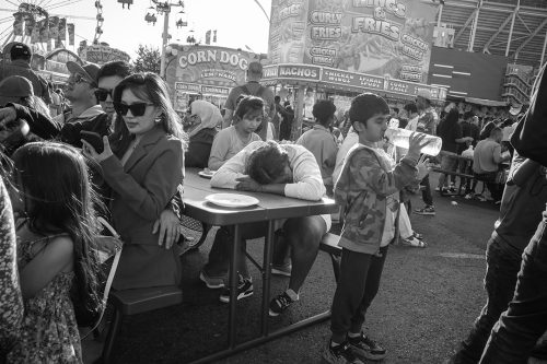 Monochrome image of people at CNE.