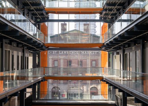 Multiple levels of the St. Lawrence Market North building, with the South building visible through large windows.