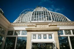 Exterior of Allan Gardens with glass dome and front reading 1909.