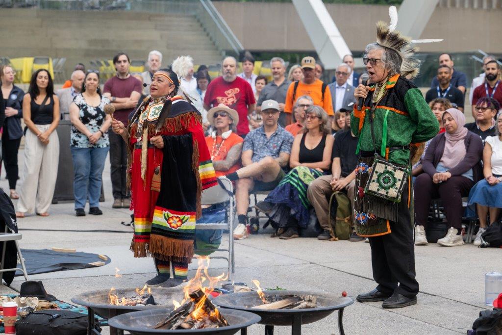 Grandmother Kim Wheatley (Curve Lake First Nation) and Elder Garry Sault (Mississaugas of the Credit First Nation) leading the National Indigenous Peoples Day Sunrise Ceremony on June 21, 2024.