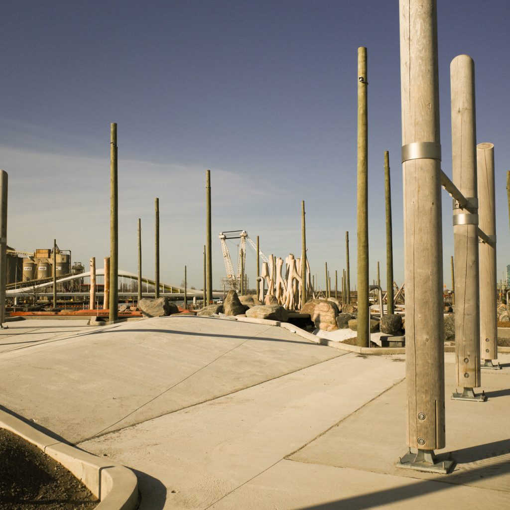 A concrete area with posts.
