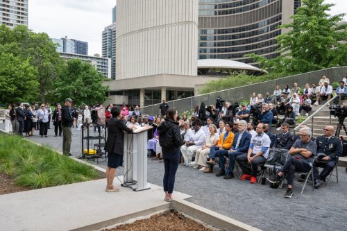 2024 National Day Against Gun Violence Ceremony at the Peace Garden. women addressing to a group of seated attendees. 