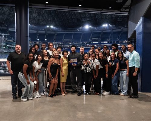 Group of people on a stage, in the centre Mayor Chow and The Weeknd