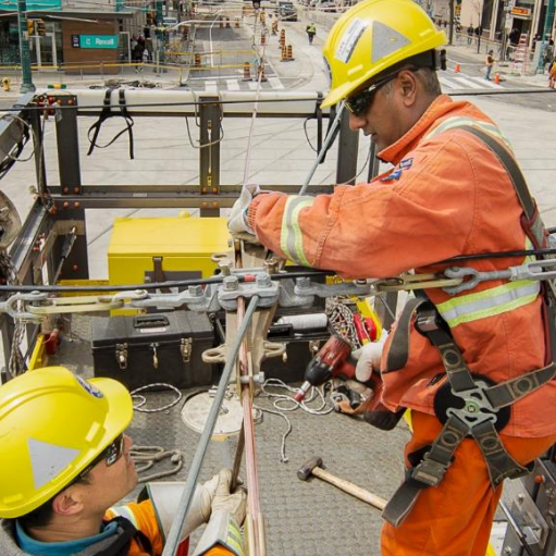 TTC crews work on overhead wires for streetcars