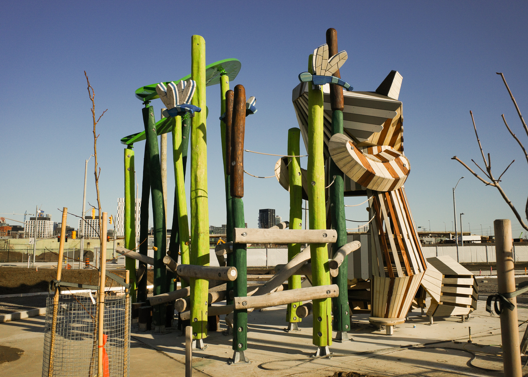 Reaching Raccoon climbing play structure.