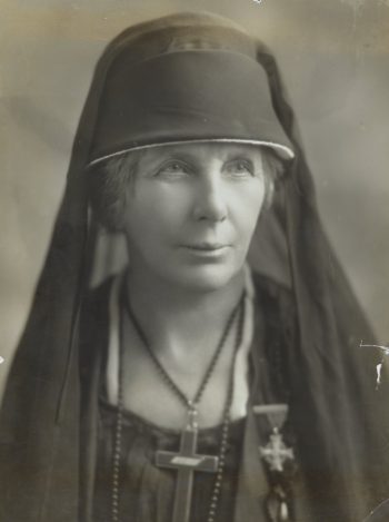 Portrait of a woman in Edwardian mourning wear, with veil.