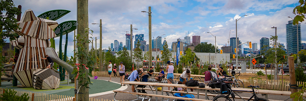 People using the picnic tables at the Raccoon Picnic Terrace.