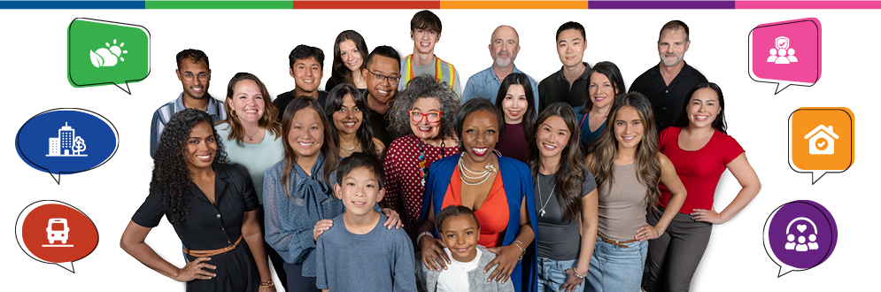 A diverse group of people standing against a white back drop posing for a photo. Colourful speech bubbles feature icons for transit, housing, the environment, buidings and people.