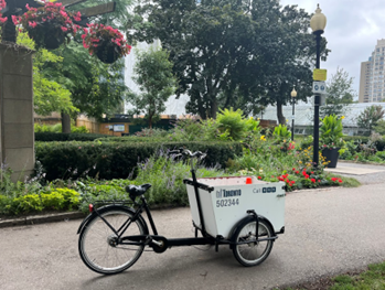 Image of a city of toronto cargo e-bike that is white and blue.