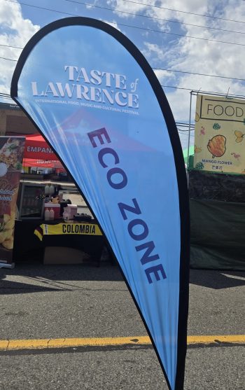 A sign reading Taste of Lawrence Eco Zone