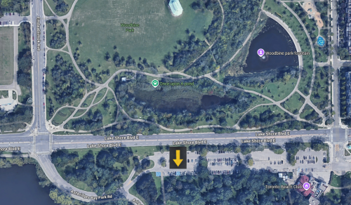 Satellite map of parking lot located at the south east corner of Emdaabiimok Avenue and Lake Shore Boulevard East with graphic arrow point to bottom middle section of the parking lot