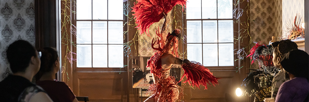 Dancer in a historic house performs to audience