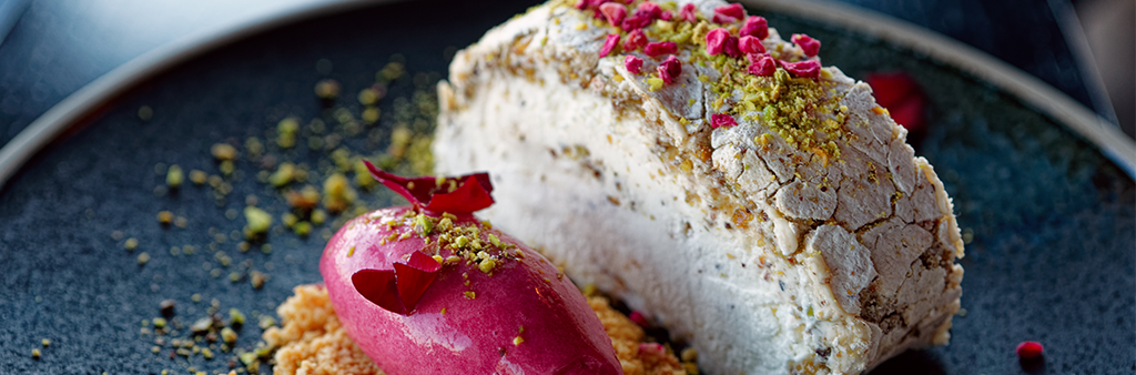 Two plated meringue desserts