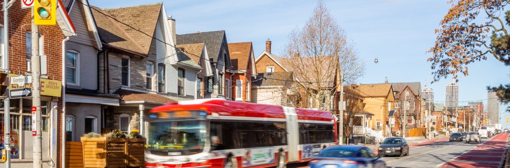 Red priority bus lanes on Dufferin Street at Gordon Street.