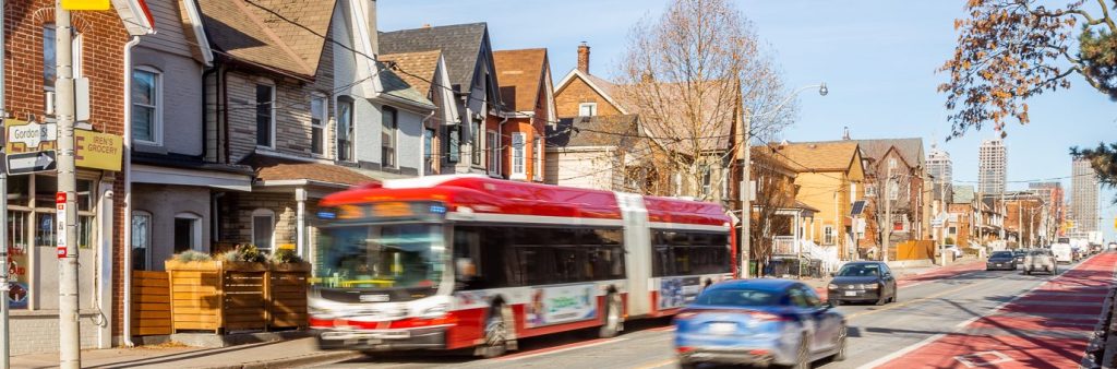 Red priority bus lanes on Dufferin Street at Gordon Street.