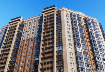 A residential building with a blue sky in the background.