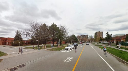 Artist rendering of Option 2 - bike lanes on one side and shared lane markings on the school side